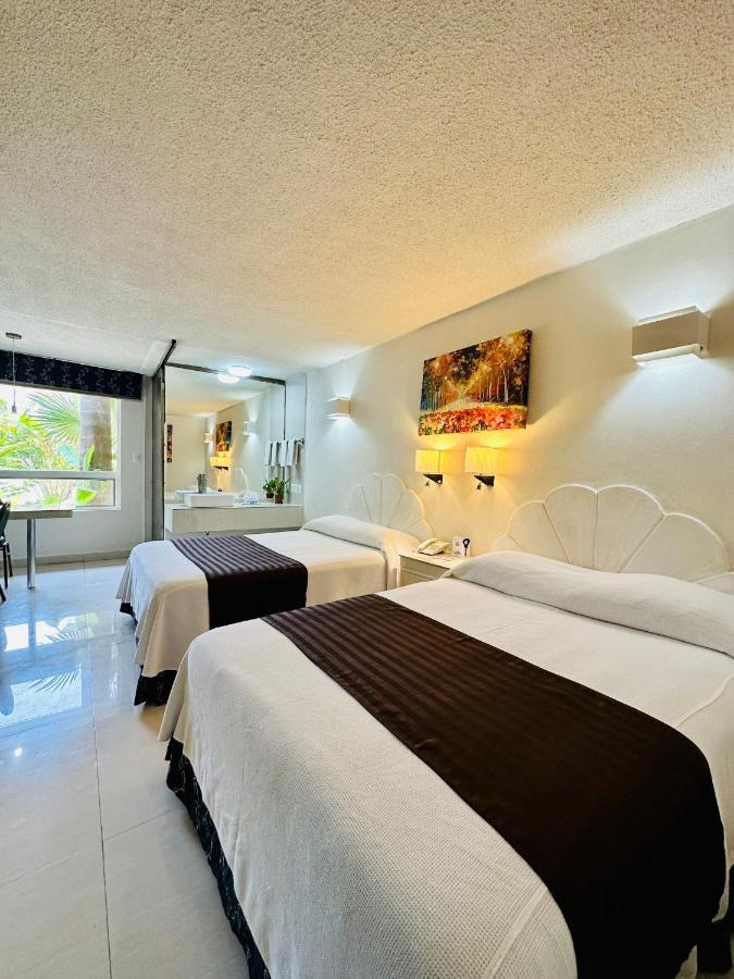 Hotel Plaza Caribe Канкун Экстерьер фото